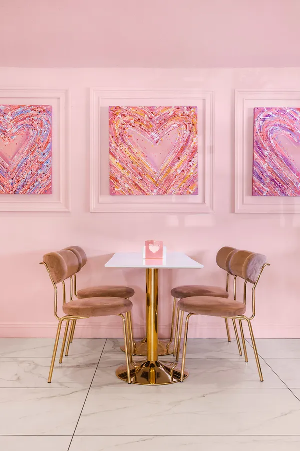 a view of a chairs and table in a entryway