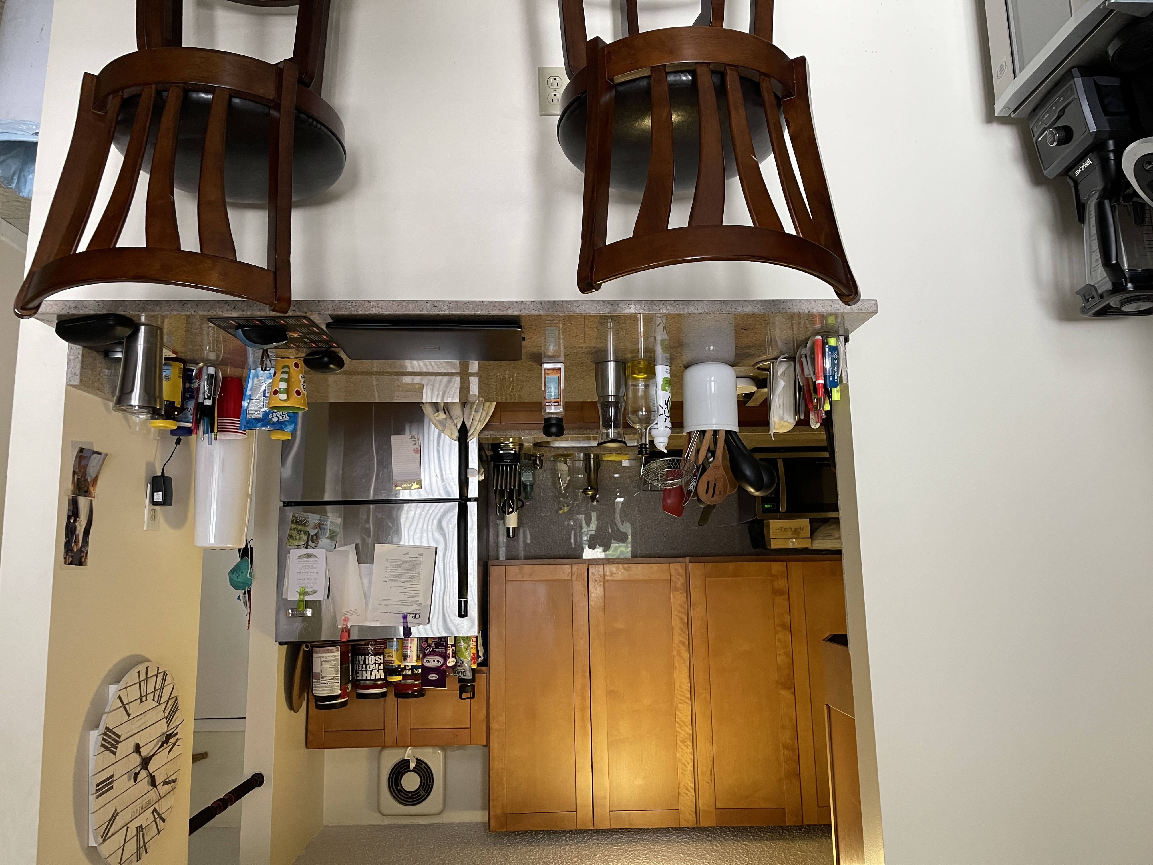 25-40 Shore Boulevard, Unit 5B Queens, NY 11102 - Photo 3 of 24 a kitchen with a table chairs and a refrigerator