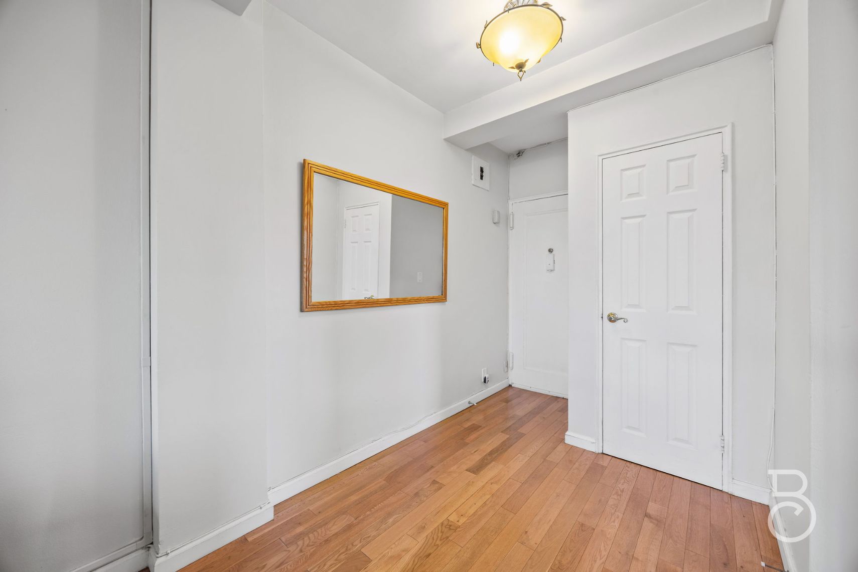 99-52 66th Road, Unit 5D Queens, NY 11374 - Photo 10 of 13 a view of a room with wooden floor and window