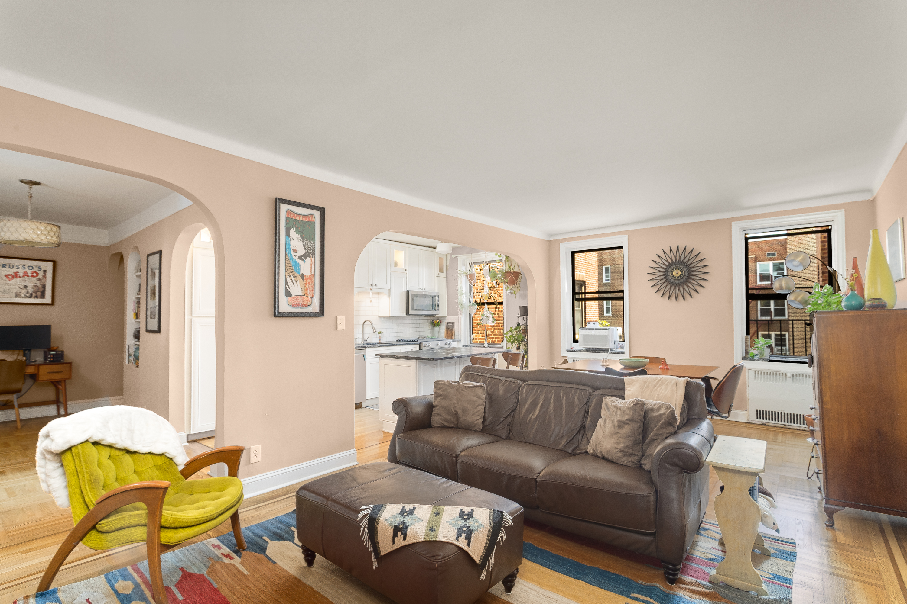 35-06 88th Street, Unit 5DD Queens, NY 11372 - Photo 3 of 18 a living room with furniture and a large window