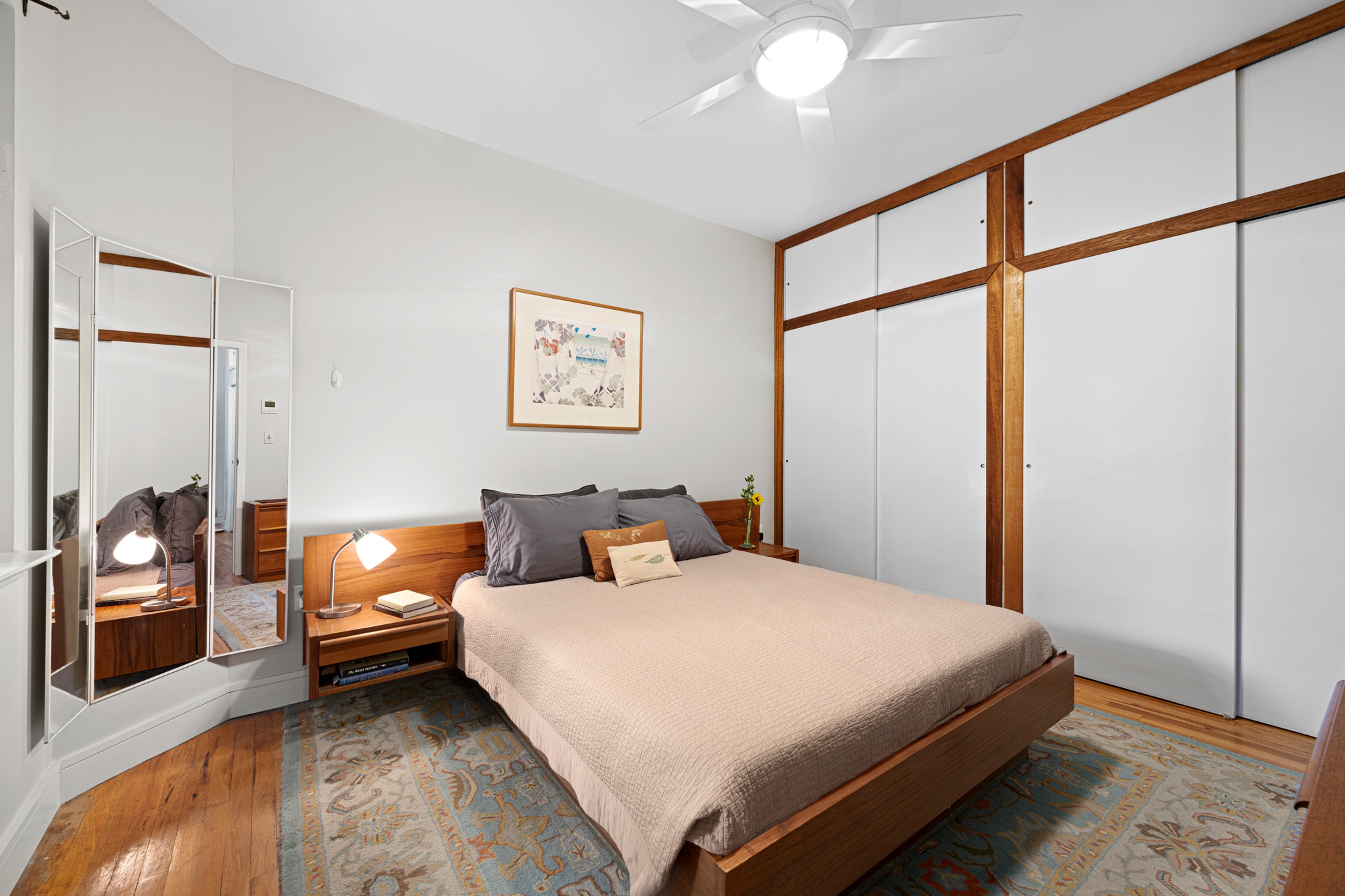 166 Bank Street, Unit LOFT2C Manhattan, NY 10014 - Photo 5 of 11 a bedroom with a bed and a chandelier