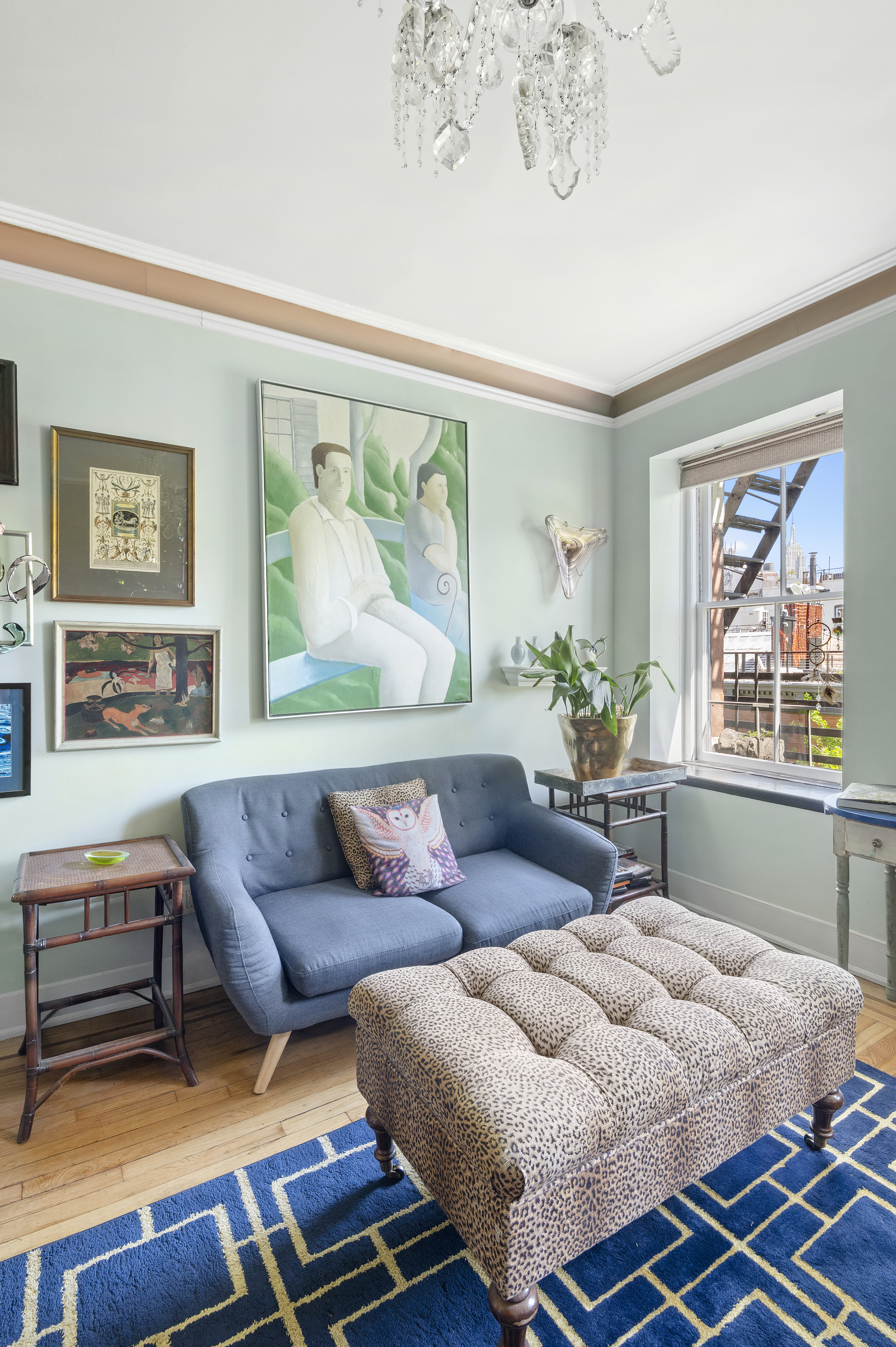 306 West 4th Street, Unit D3 Manhattan, NY 10014 - Photo 2 of 9 a living room with furniture and a large window