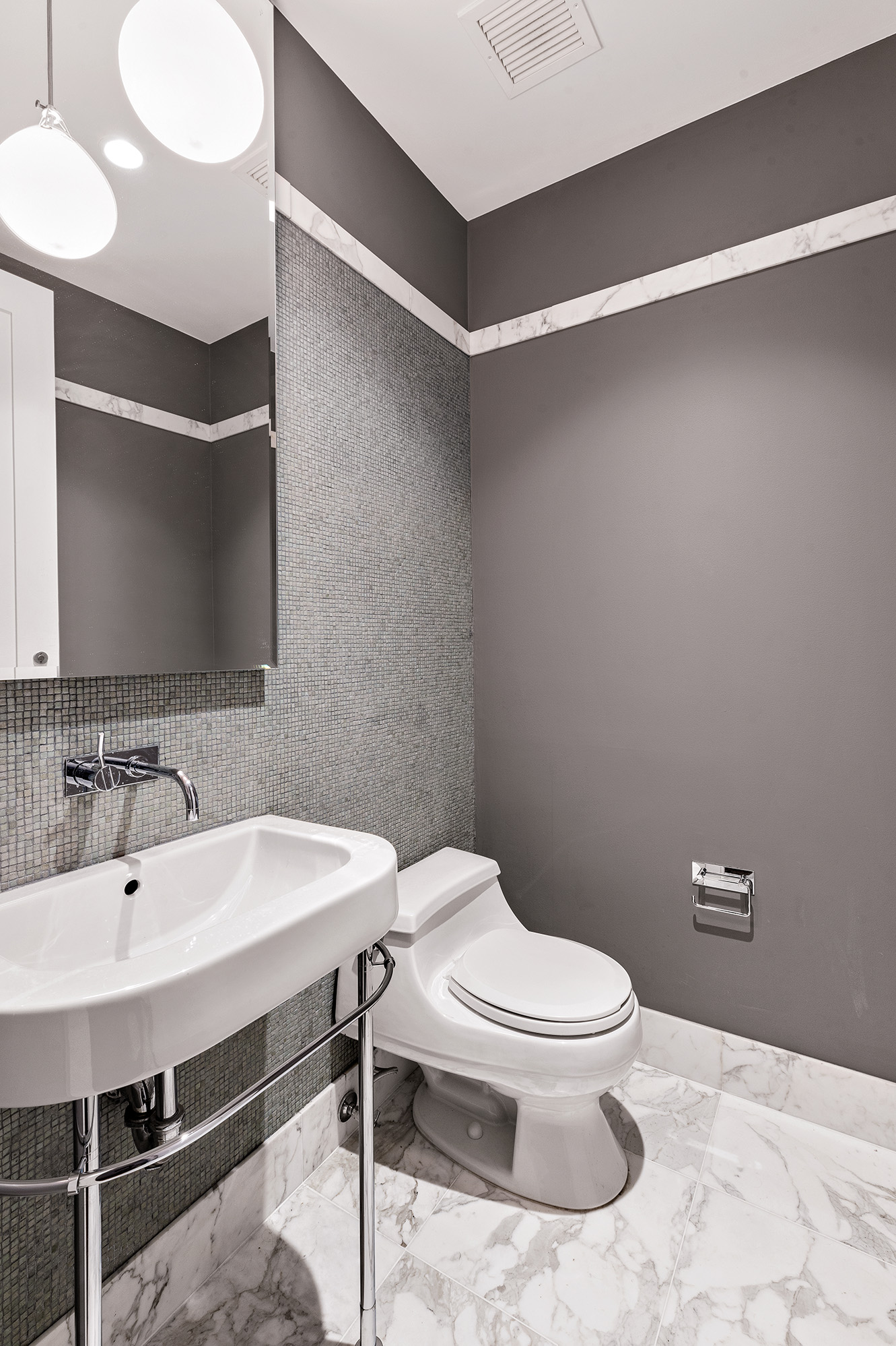 260 Park Avenue South, Unit 6I Manhattan, NY 10010 - Photo 3 of 9 a bathroom with a sink a toilet and a mirror