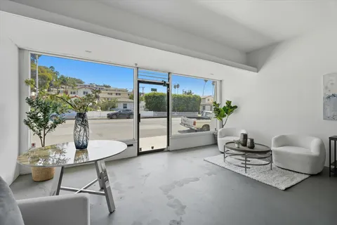 a kitchen with a stove top oven cabinets and stainless steel appliances