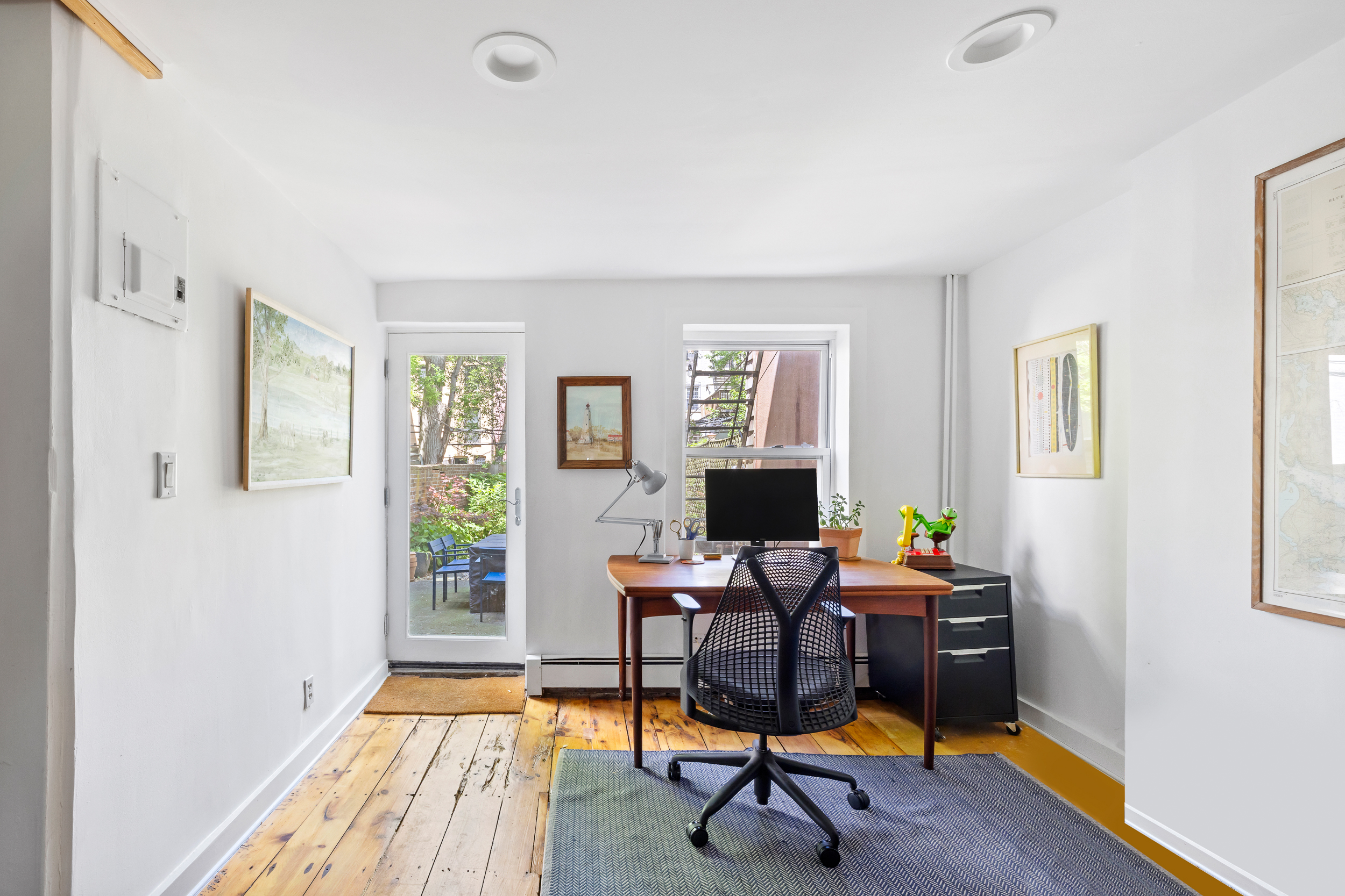 437 Warren Street Brooklyn, NY 11217 - Photo 8 of 17 a workspace with wooden floor and a window