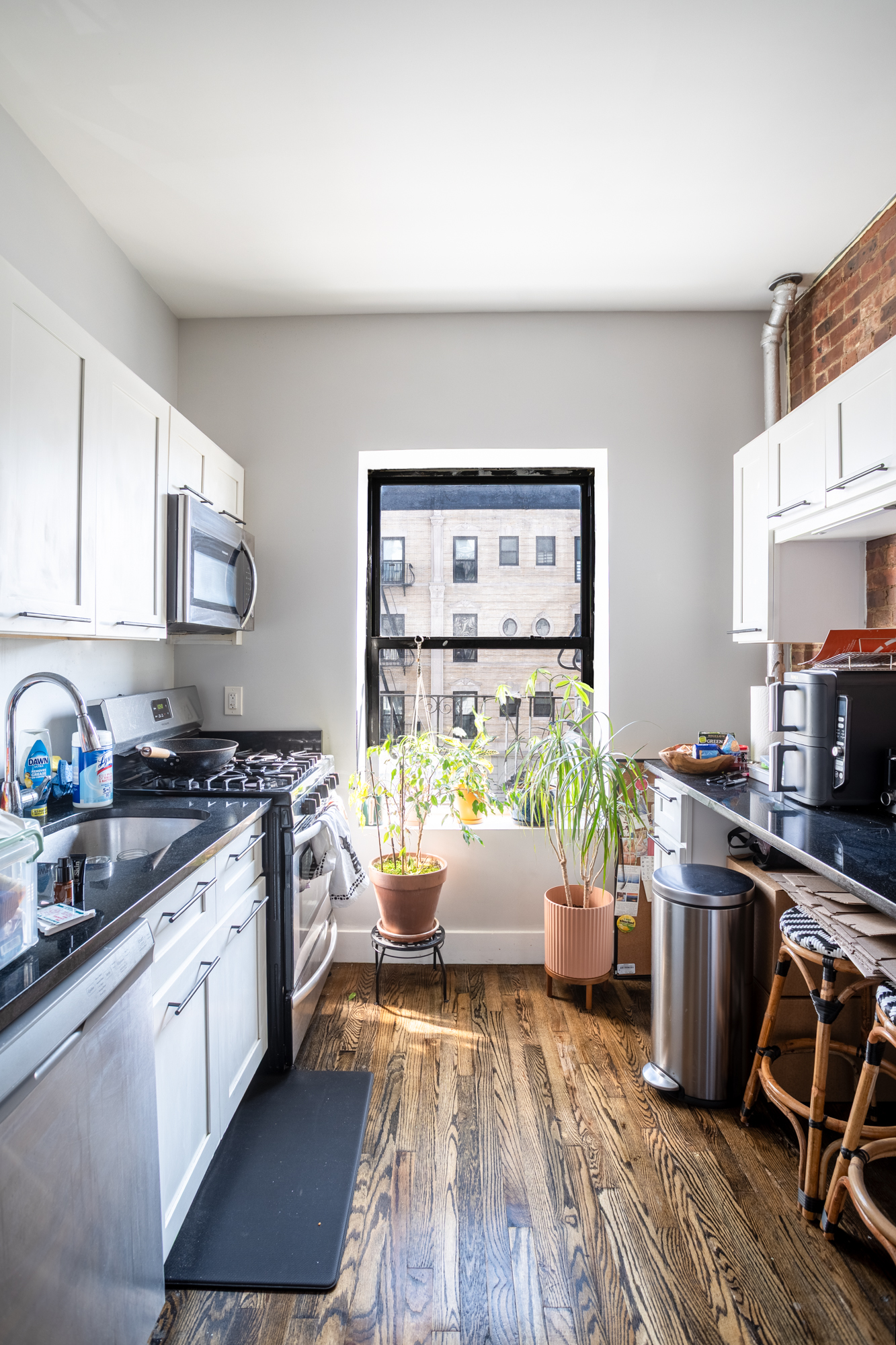 944 Marcy Avenue, Unit 3D Brooklyn, NY 11216 - Photo 2 of 9 a kitchen with stainless steel appliances a stove a sink a refrigerator wooden floor and cabinets