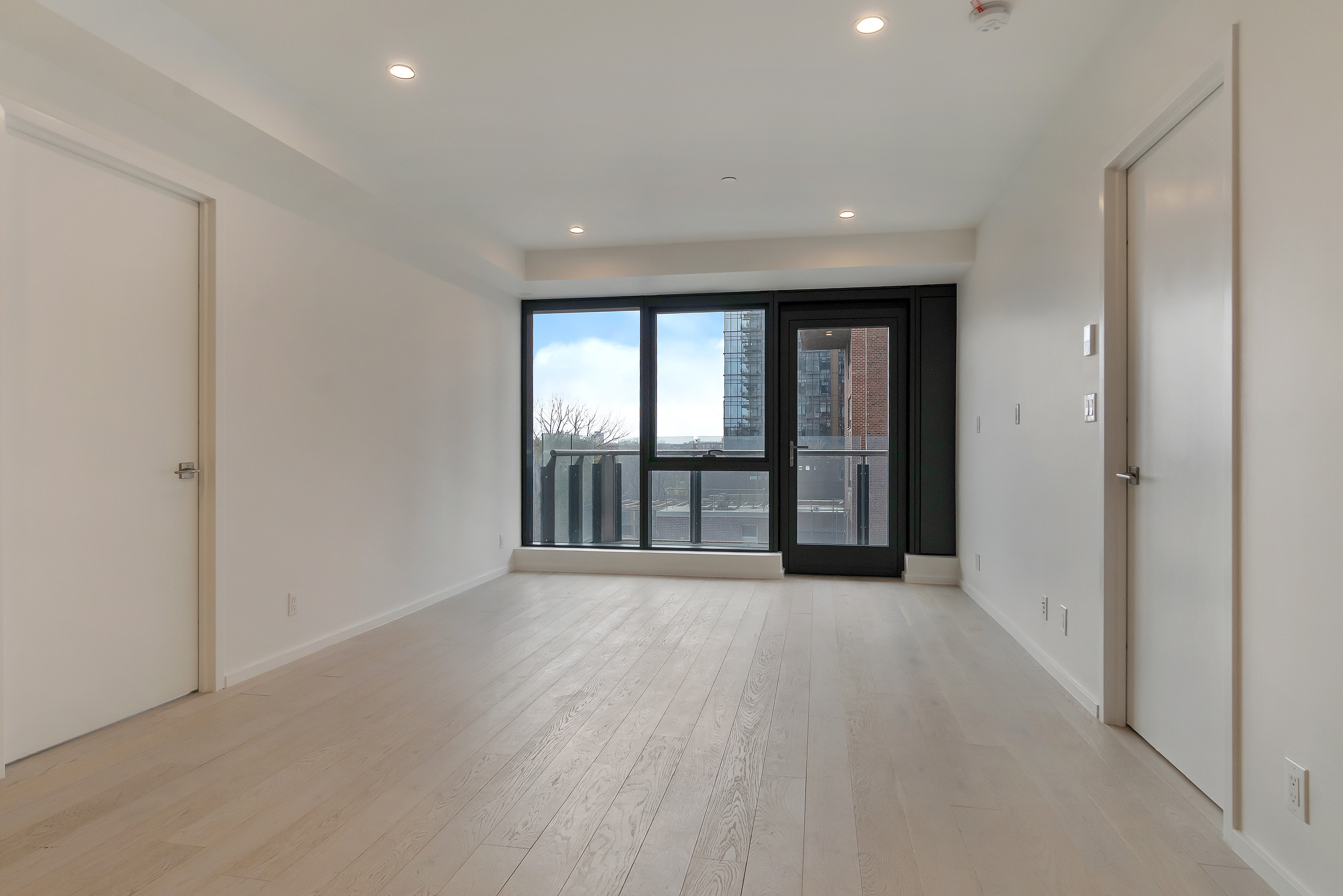 2286 Cropsey Avenue, Unit 6G Brooklyn, NY 11214 - Photo 15 of 22 wooden floor in an empty room with a window