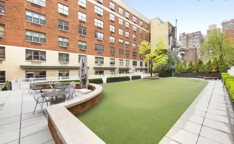 a view of a swimming pool with a lounge chairs