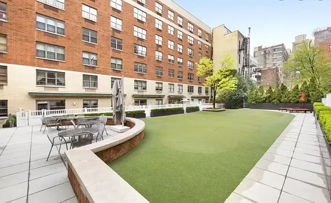 a view of a swimming pool with a lounge chairs