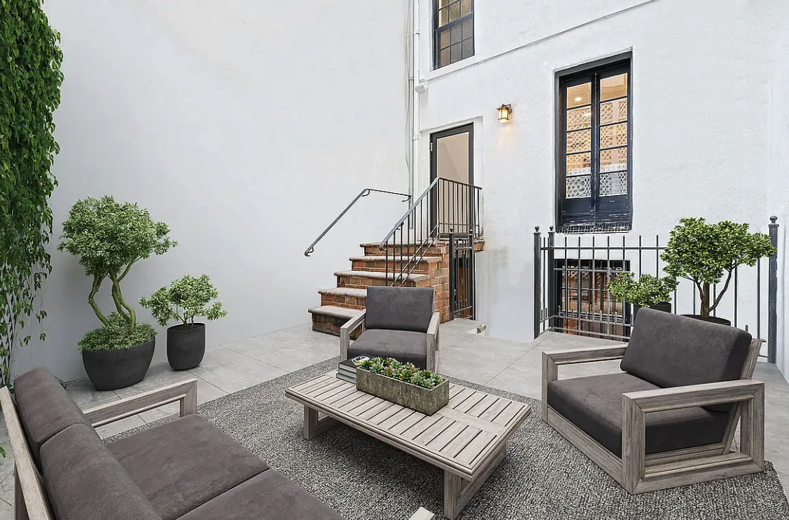 58 Downing Street Manhattan, NY 10014 - Photo 20 of 21 a view of living room filled with furniture and a potted plant