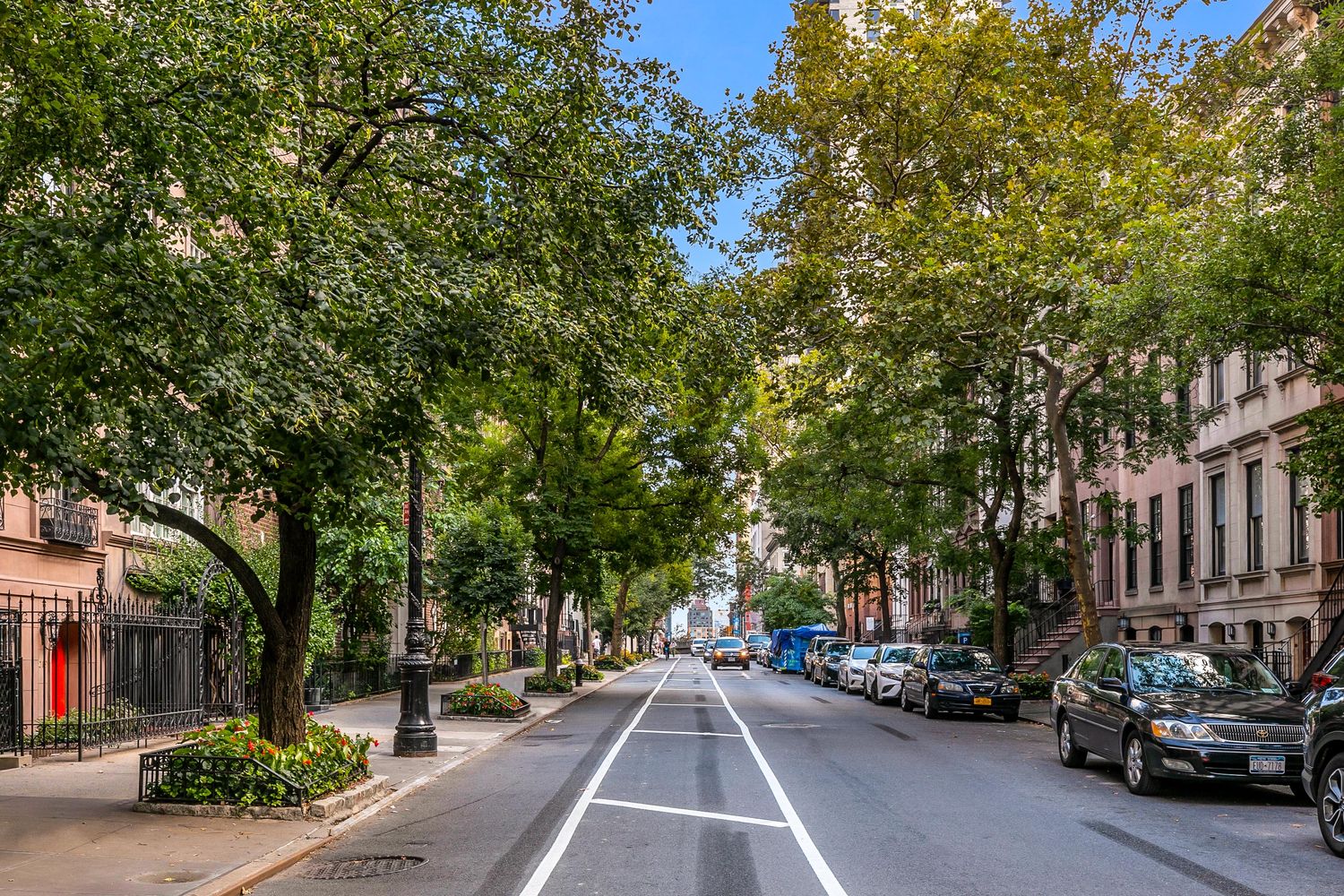 209 East 61st Street Manhattan, NY 10065 - Photo 22 of 24 a view of a city street with cars