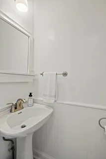 a view of front door with wooden floor and stairs