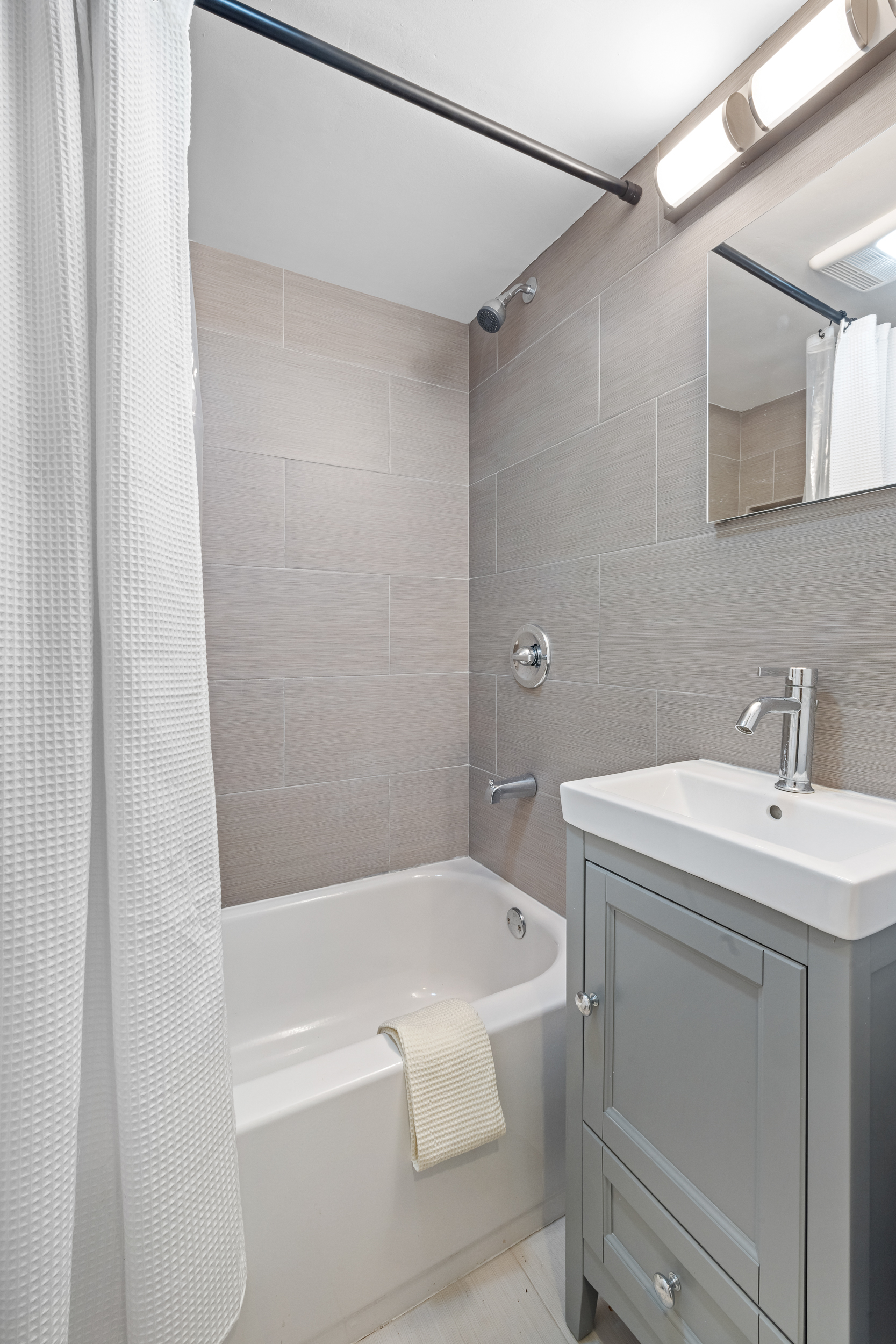 716 Monroe Street Brooklyn, NY 11221 - Photo 19 of 22 a bathroom with a sink and a bathtub