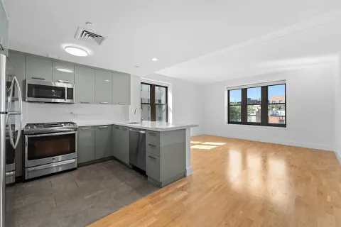 a kitchen with stainless steel appliances granite countertop a stove and a sink