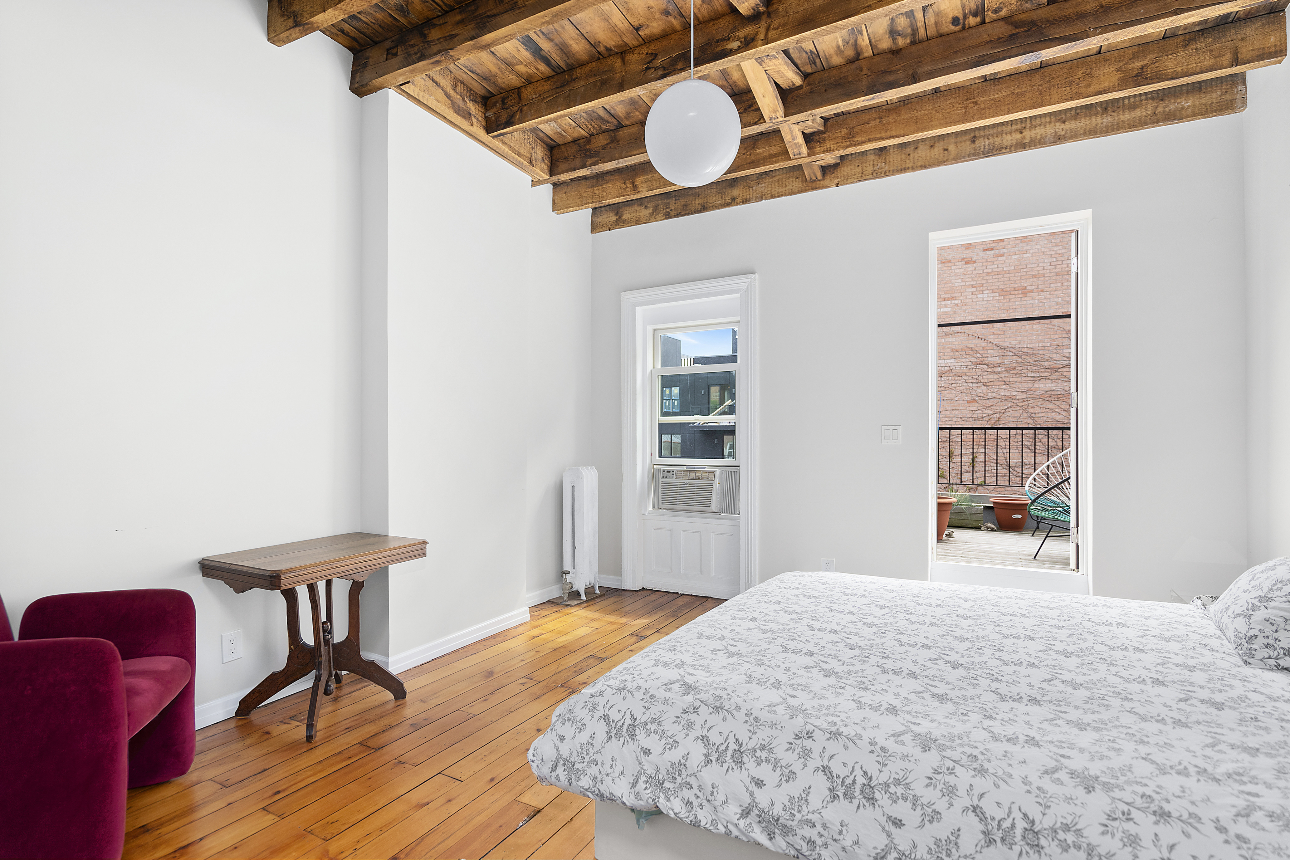 394 Lafayette Avenue, Unit 2 Brooklyn, NY 11238 - Photo 8 of 13 a bedroom with a bed dresser and a window