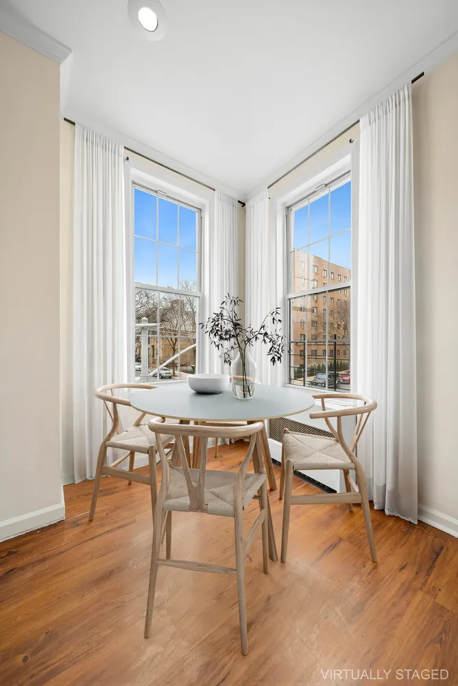 a view of a dining room with furniture window and outside view