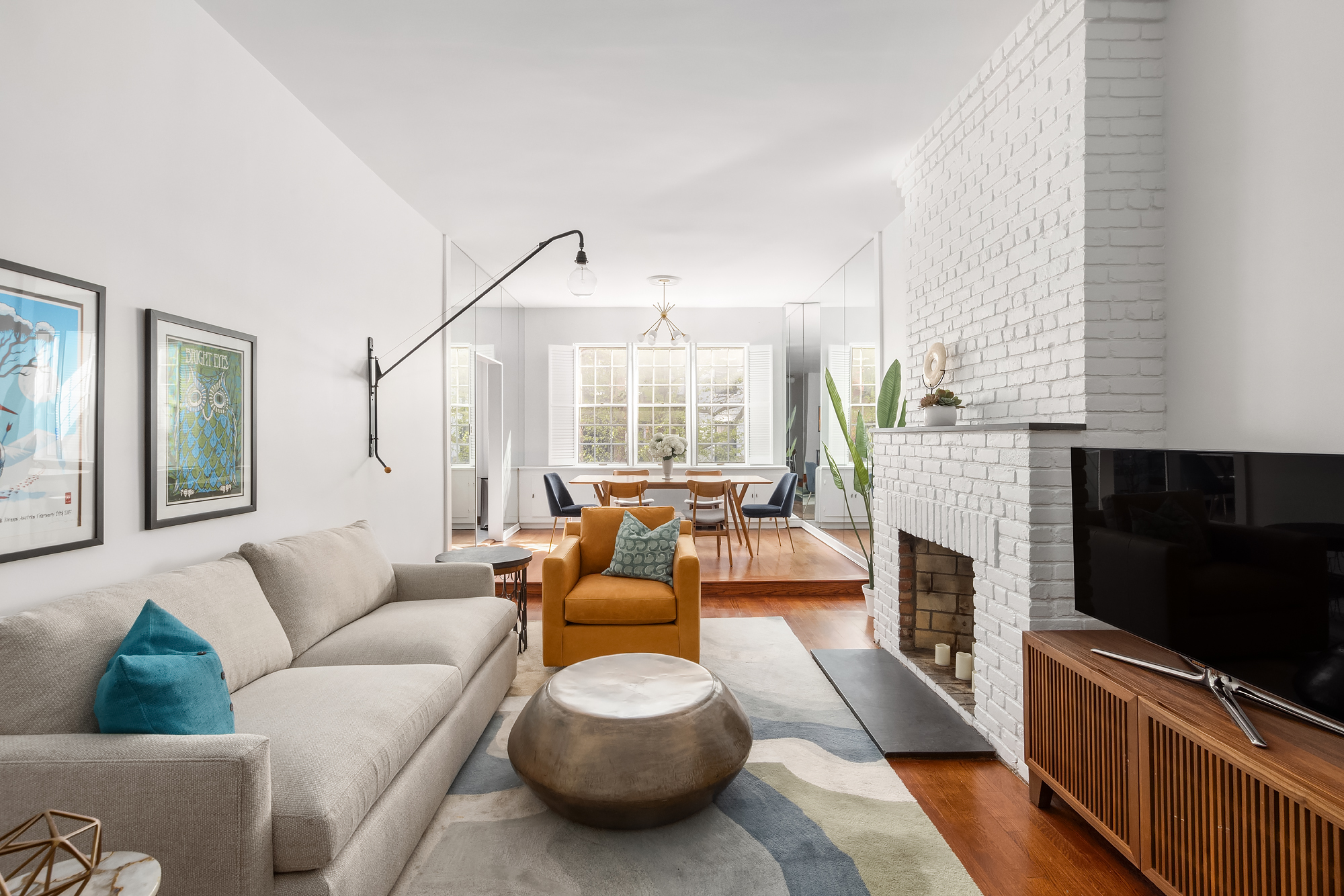 159 West 13th Street Manhattan, NY 10011 - Photo 13 of 36 a living room with furniture and a flat screen tv
