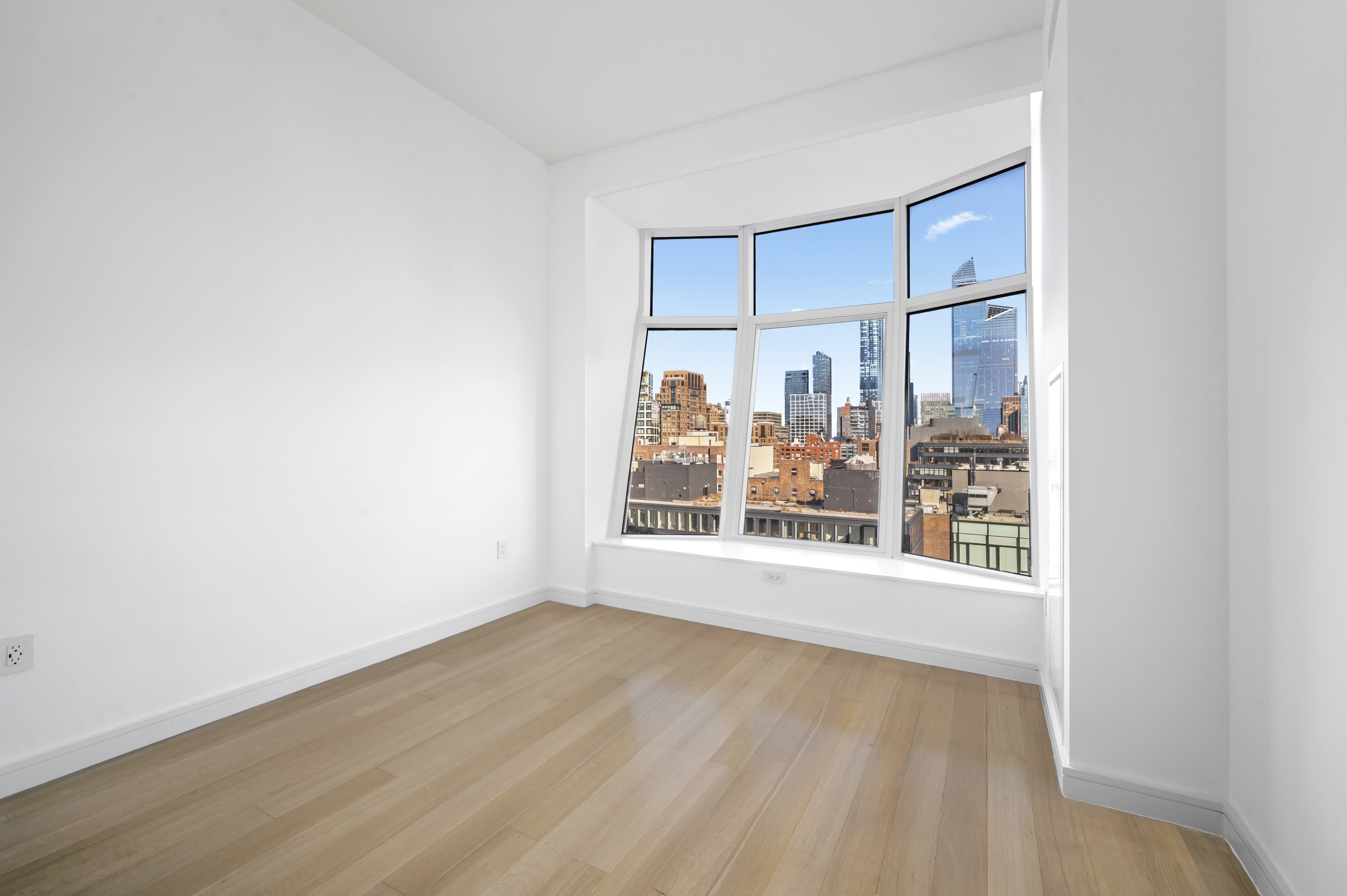 515 West 18th Street, Unit 1401 Manhattan, NY 10011 - Photo 8 of 12 a view of an empty room with a window