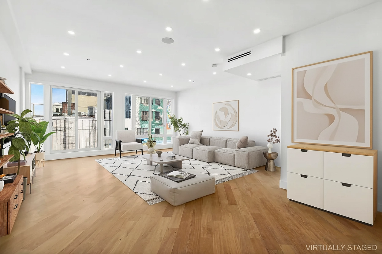 483 Hart Street, Unit PH Brooklyn, NY 11221 - Photo 1 of 17 a living room with furniture and a wooden floor