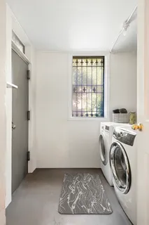 a view of entryway with washer and dryer