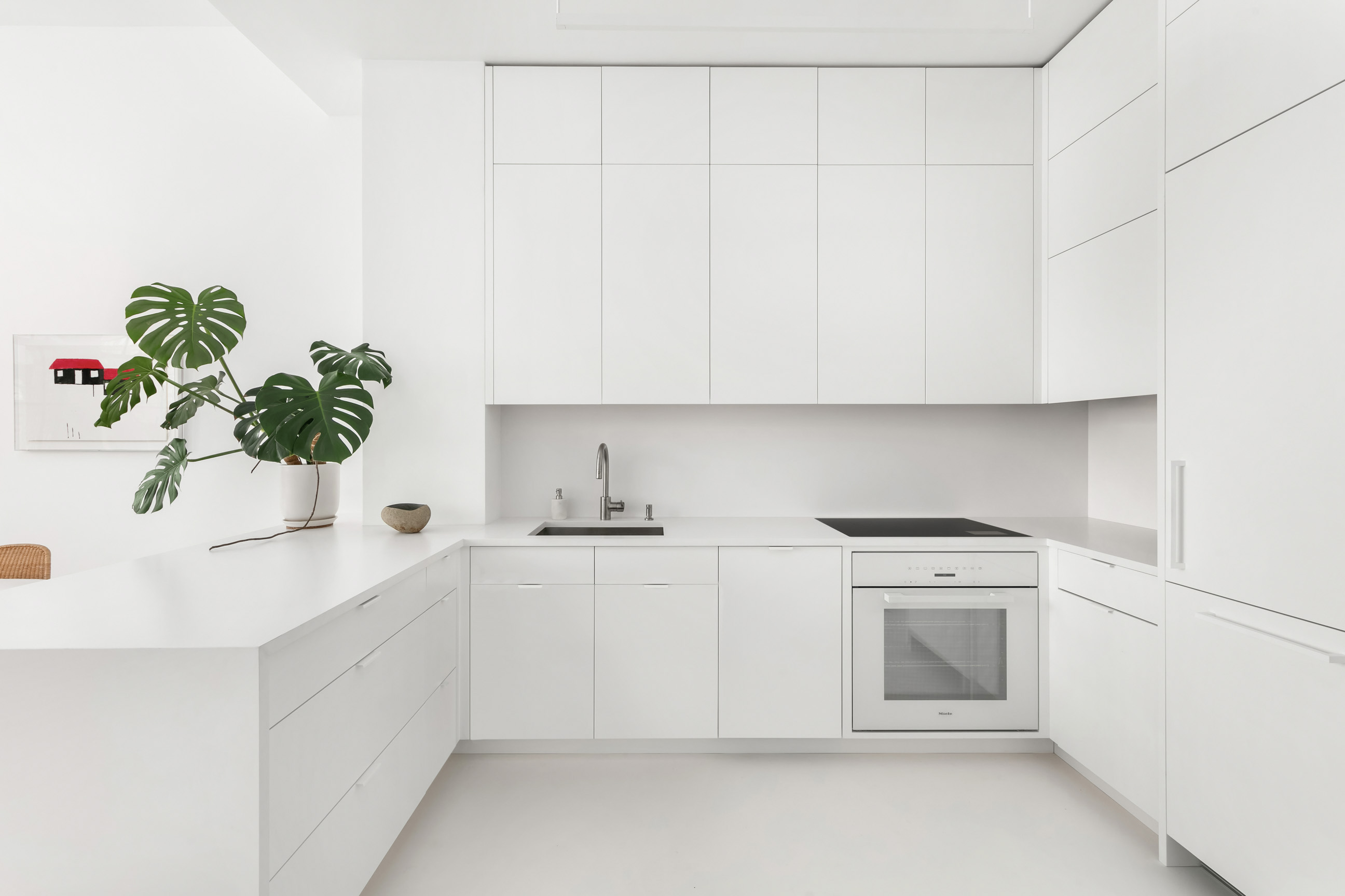 111 4th Avenue, Unit 9M Manhattan, NY 10003 - Photo 5 of 14 a kitchen with white cabinets and sink