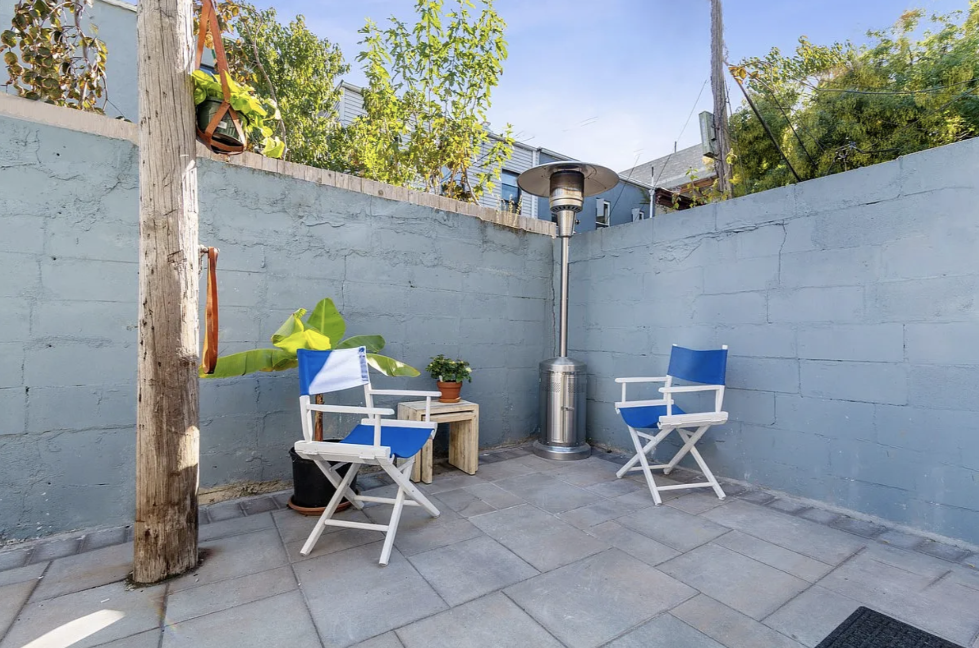 20 Suydam Street, Unit 1 Brooklyn, NY 11221 - Photo 2 of 10 a patio with a table and chairs and a potted plant