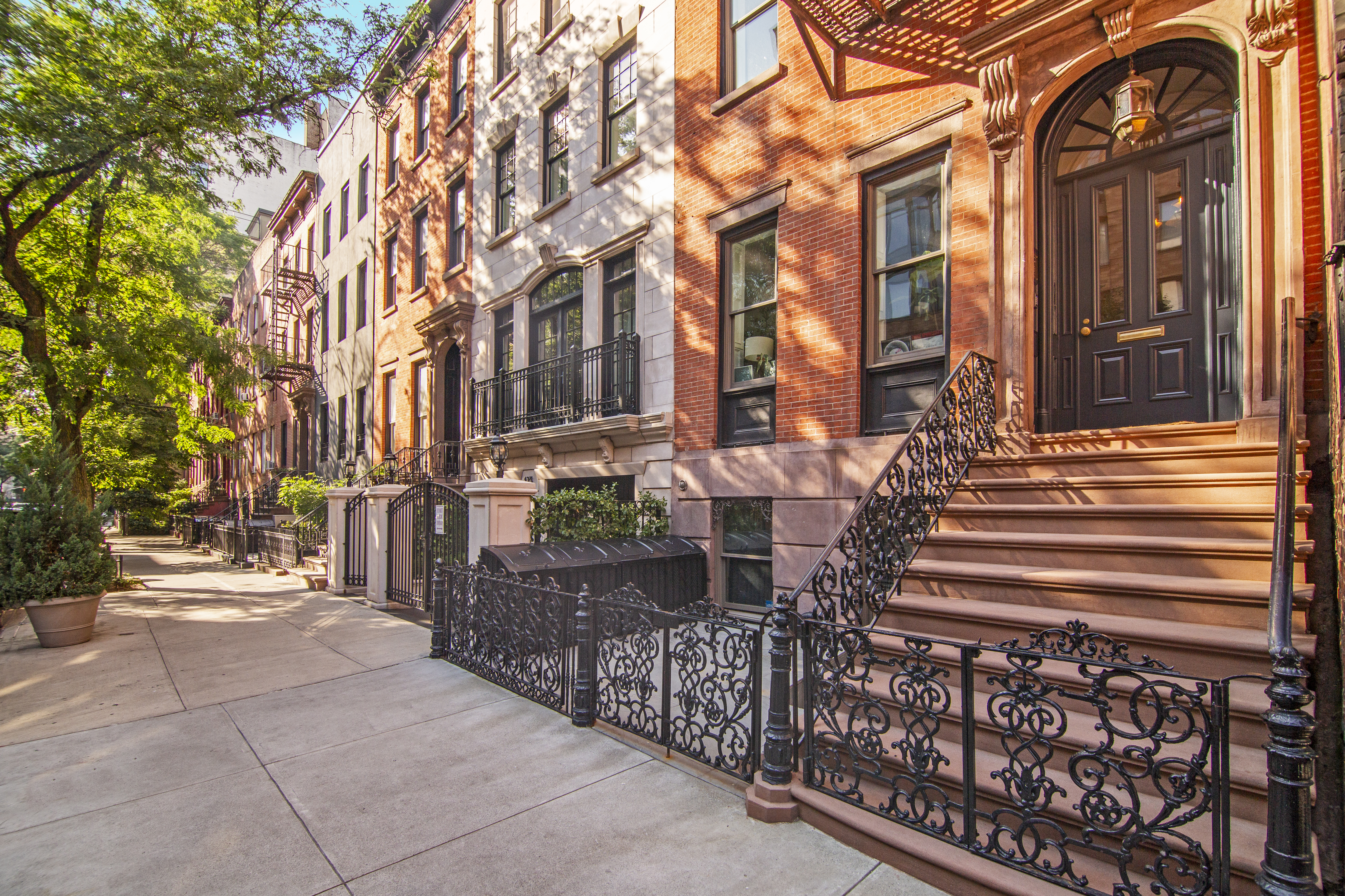113 1/2 West 15th Street, Unit 1W Manhattan, NY 10011 - Photo 9 of 12 a view of a brick house with many windows