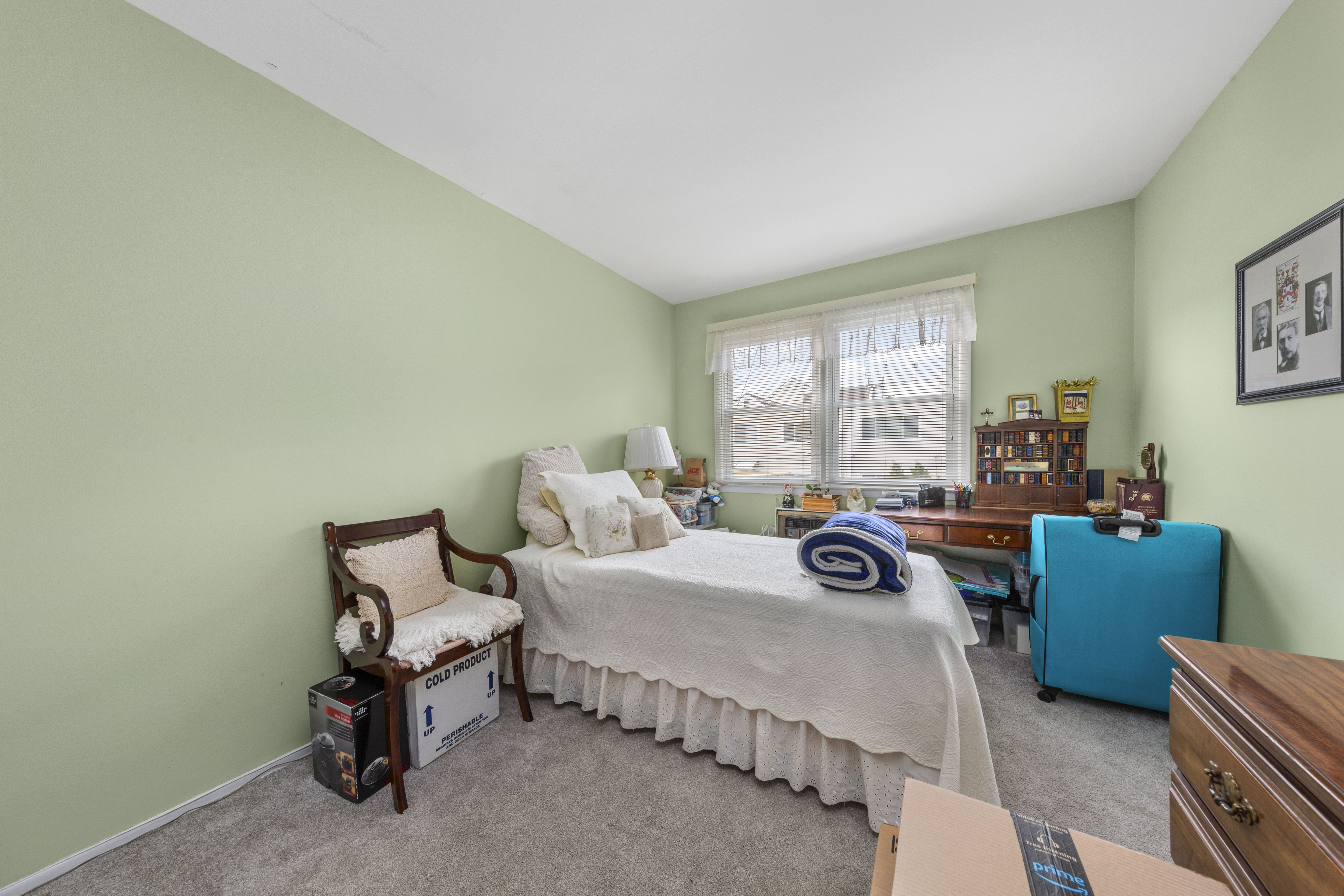 240-47 68th Avenue Queens, NY 11362 - Photo 8 of 39 a bedroom with bed and a window