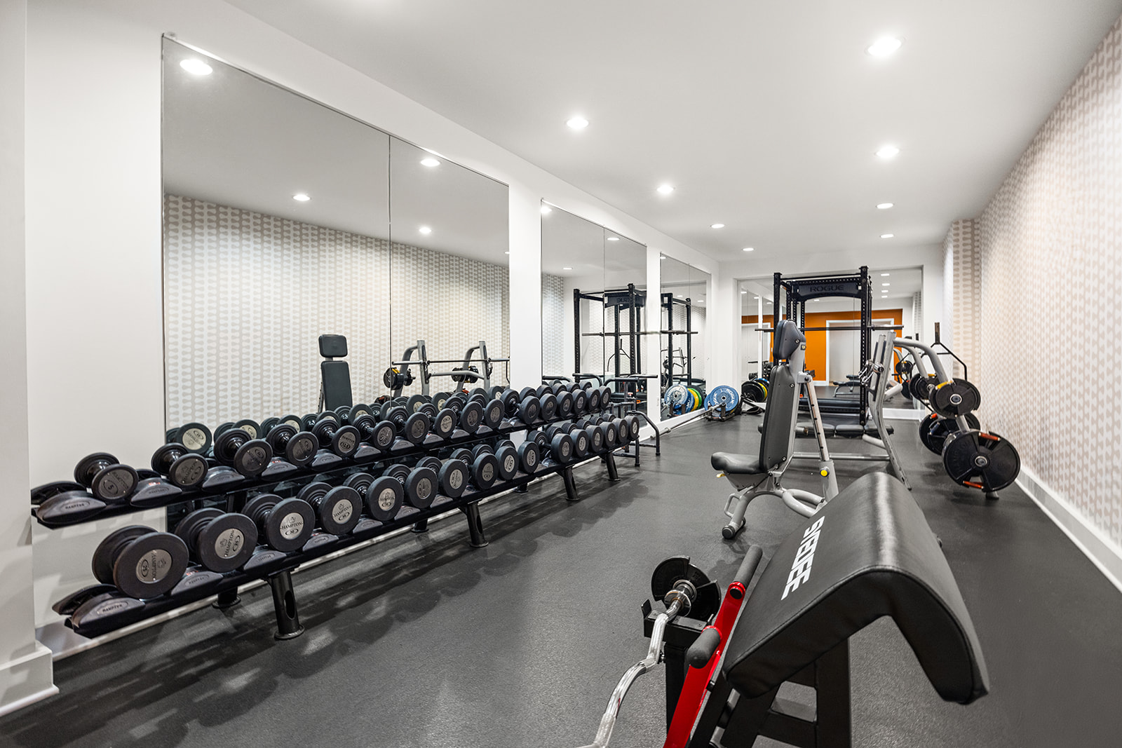 360 Furman Street, Unit 322/323 Brooklyn, NY 11201 - Photo 24 of 42 a large room with gym equipment and a large window