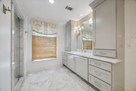 a kitchen with white cabinets and a sink