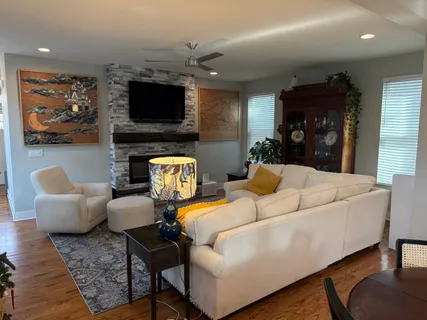 a living room with furniture and a flat screen tv