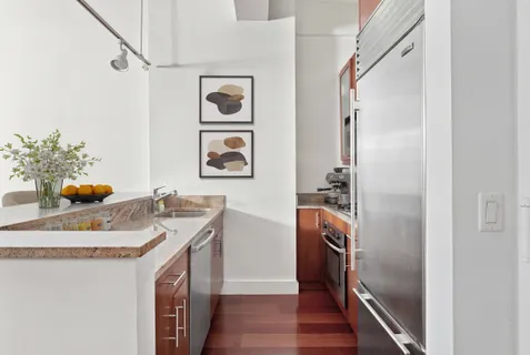 a bathroom with a sink a vanity and a mirror