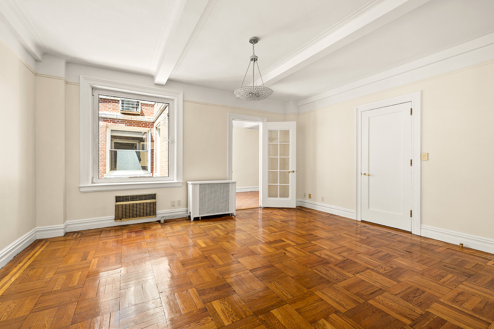 345 West 55th Street, Unit 8AB Manhattan, NY 10019 - Photo 9 of 14 a view of an empty room with a window