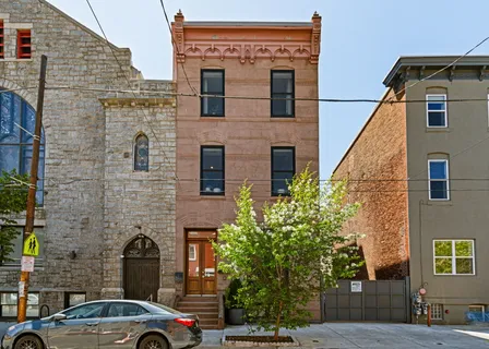 a front view of a building with parking space