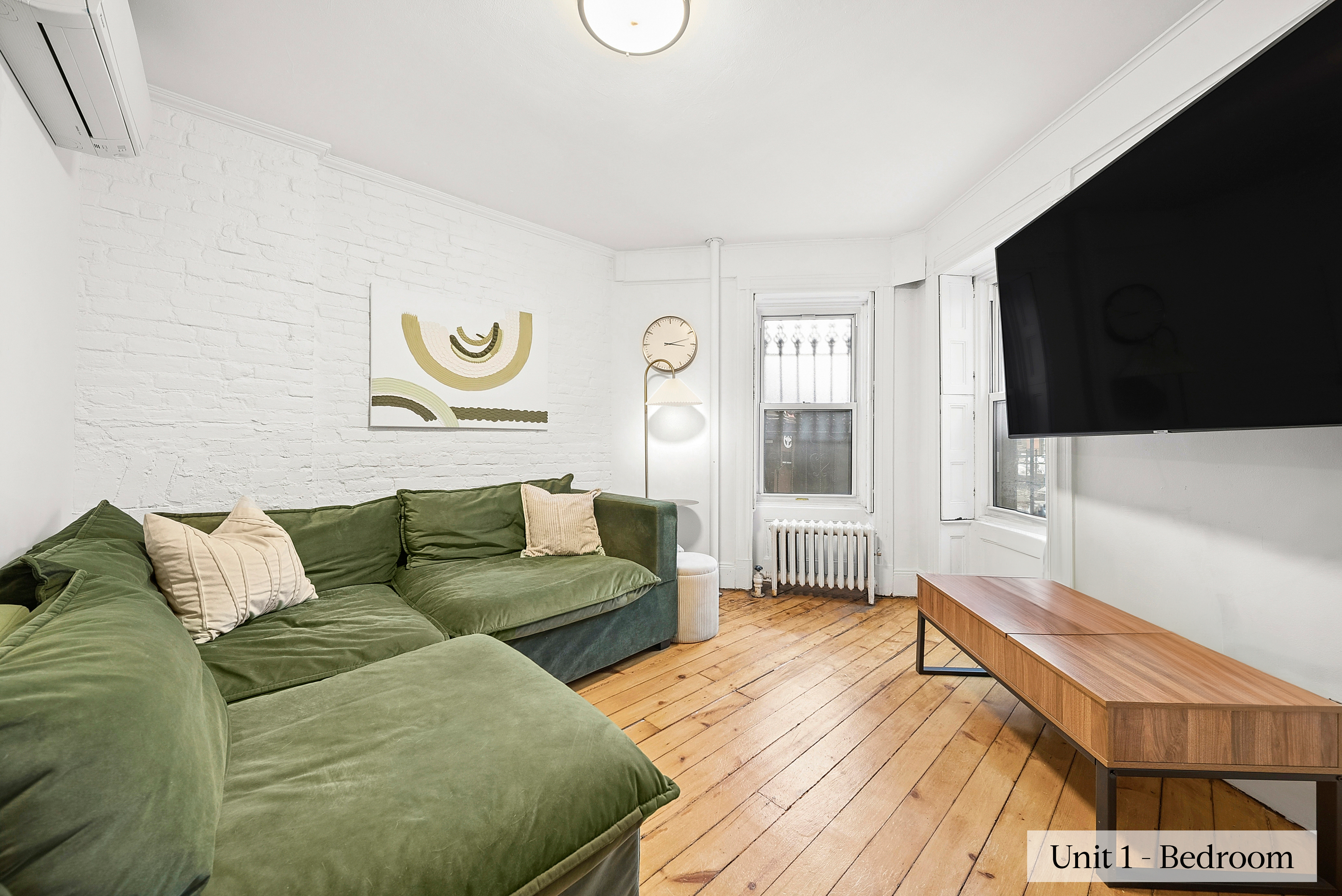 460 9th Street Brooklyn, NY 11215 - Photo 7 of 24 a living room with a couch and a flat screen tv