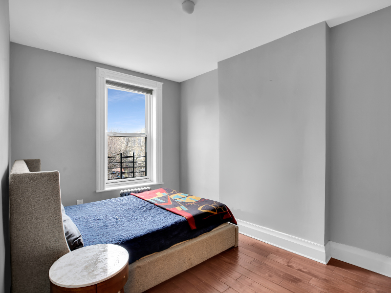 1124 Prospect Place, Unit PLEX Brooklyn, NY 11213 - Photo 14 of 15 a bedroom with a bed and a window