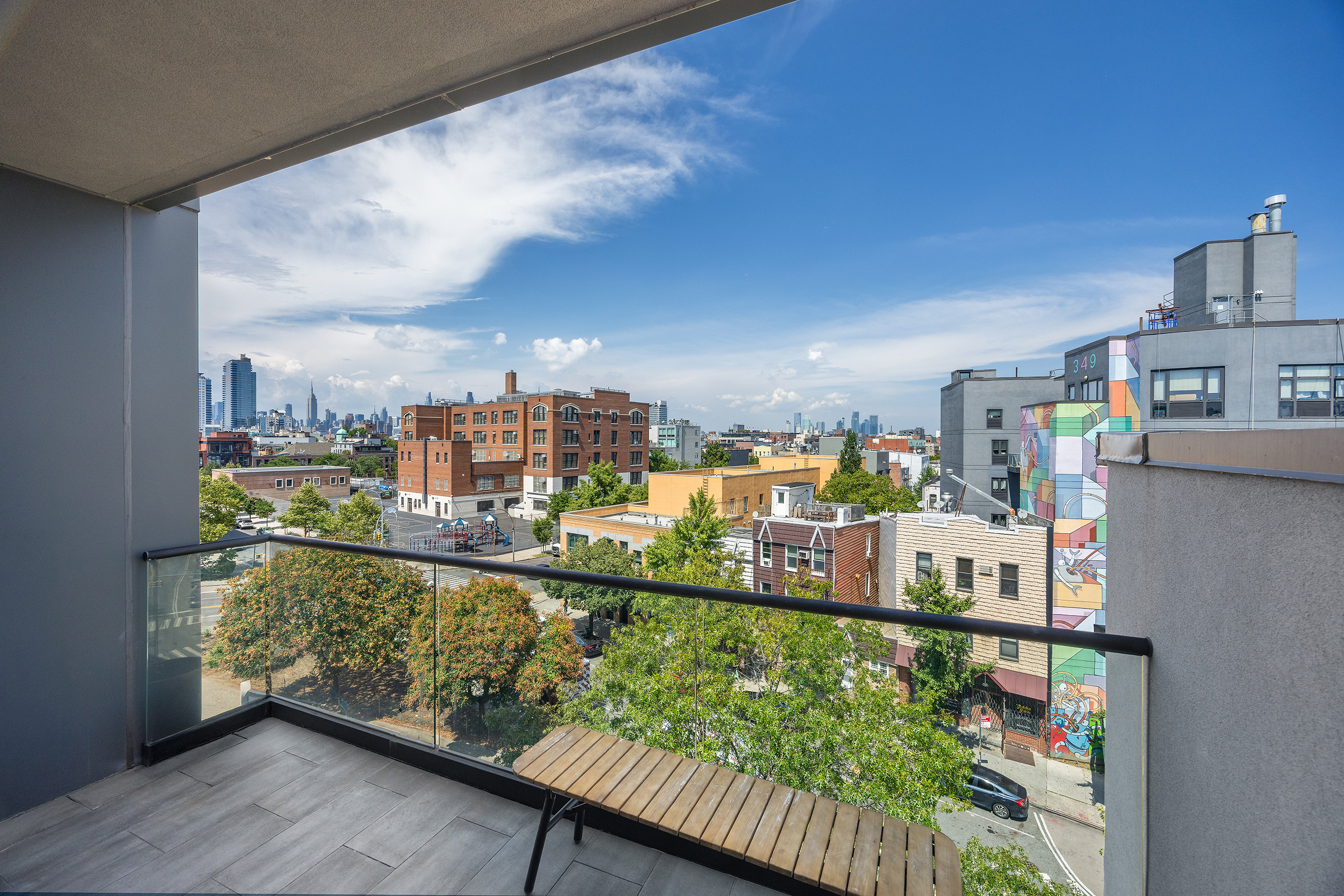 340 Metropolitan Avenue, Unit PHB Brooklyn, NY 11211 - Photo 12 of 18 a city view from a balcony