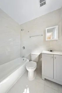 a bathroom with a toilet sink and a bathtub