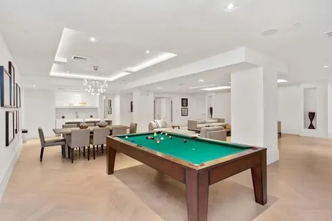 a view of kitchen with table and chairs