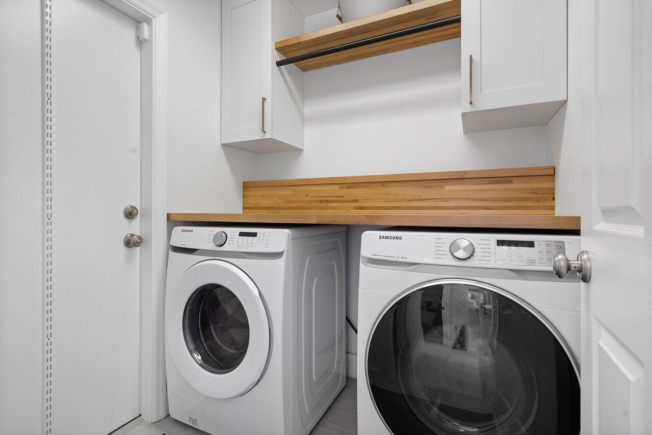 1182 Canoe Point Delray Beach, FL 33444 - Photo 28 of 46 a utility room with dryer and washer