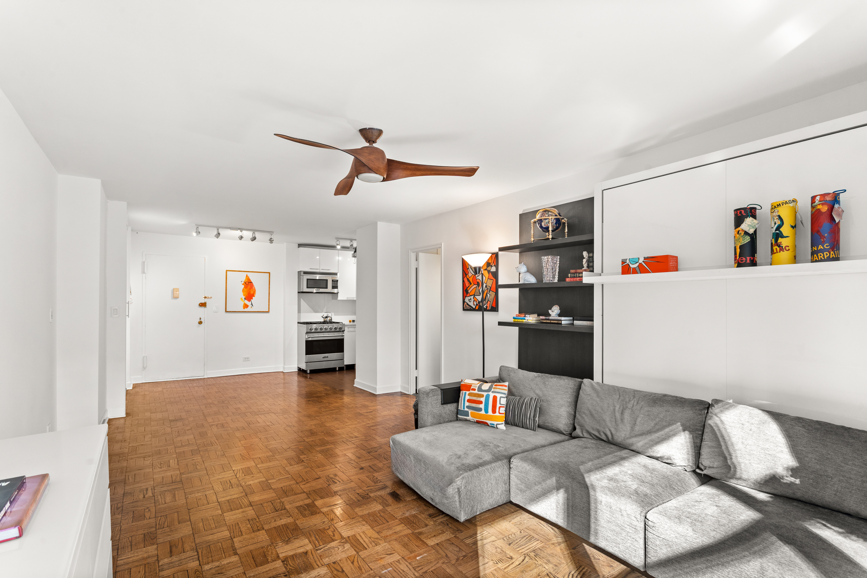 251 East 51st Street, Unit 5A Manhattan, NY 10022 - Photo 8 of 23 a living room with furniture and a couch