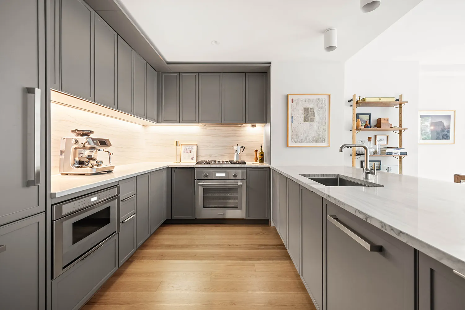 a kitchen with stainless steel appliances granite countertop a sink and stove top oven