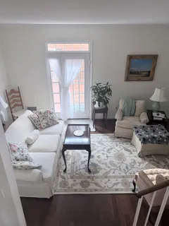 a living room with furniture and a table