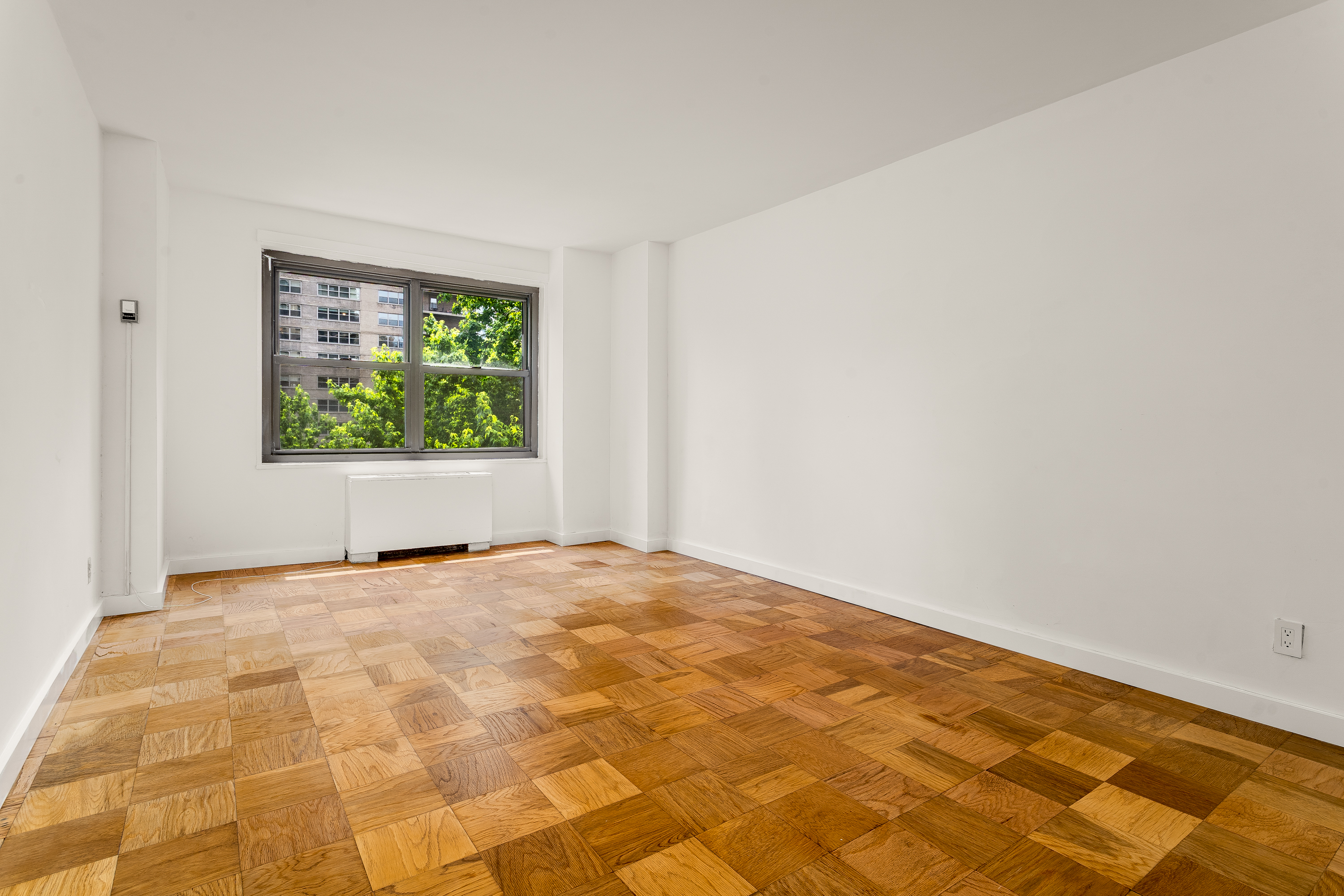 180 West End Avenue, Unit 5H Manhattan, NY 10023 - Photo 11 of 18 a view of an empty room with a window