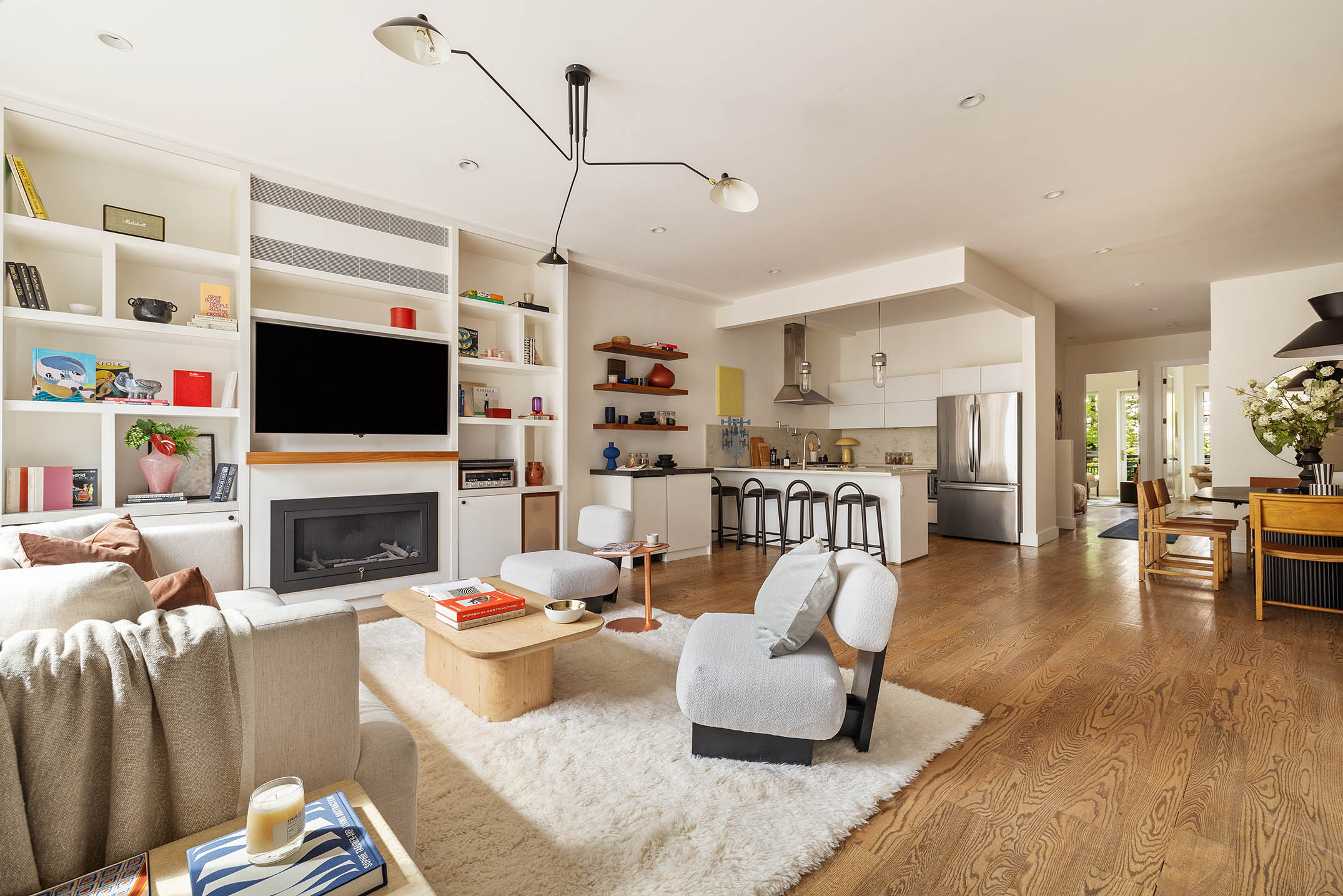 1025 Lorimer Street, Unit PARLOR Brooklyn, NY 11222 - Photo 5 of 21 a living room with fireplace furniture and a flat screen tv