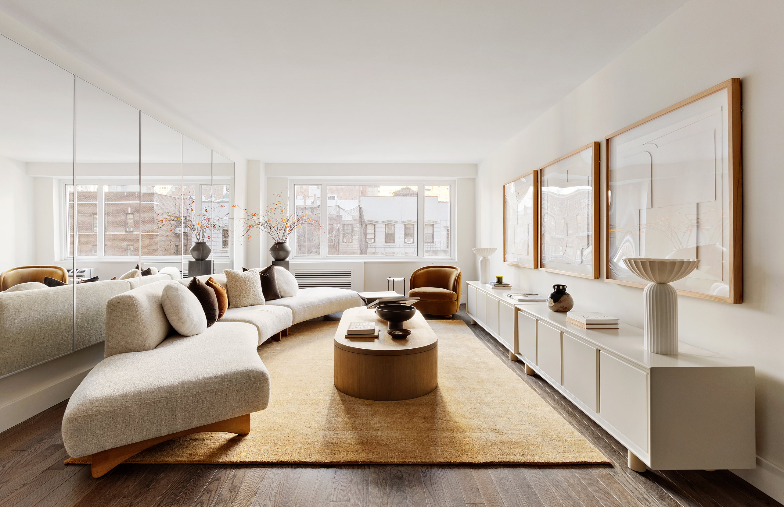 411 East 53rd Street, Unit 6L Manhattan, NY 10022 - Photo 1 of 12 a living room with furniture and a large window