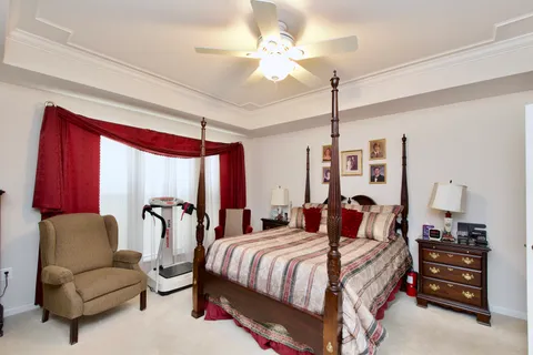 a bedroom with bed and a couch