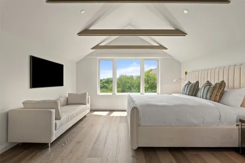 a living room with a couch and a flat screen tv