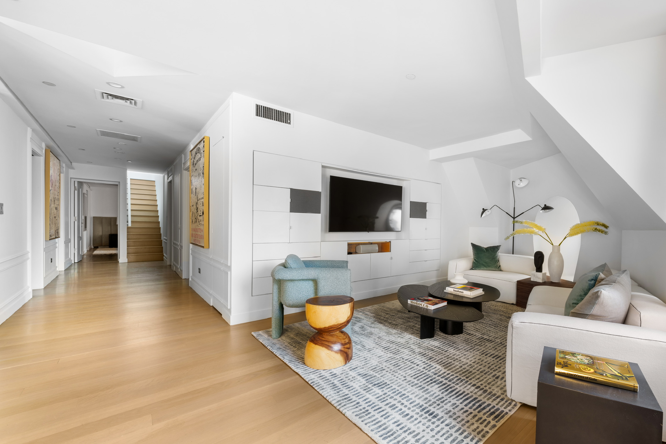 1200 Broadway, Unit PH89 Manhattan, NY 10001 - Photo 12 of 47 a living room with furniture and a flat screen tv