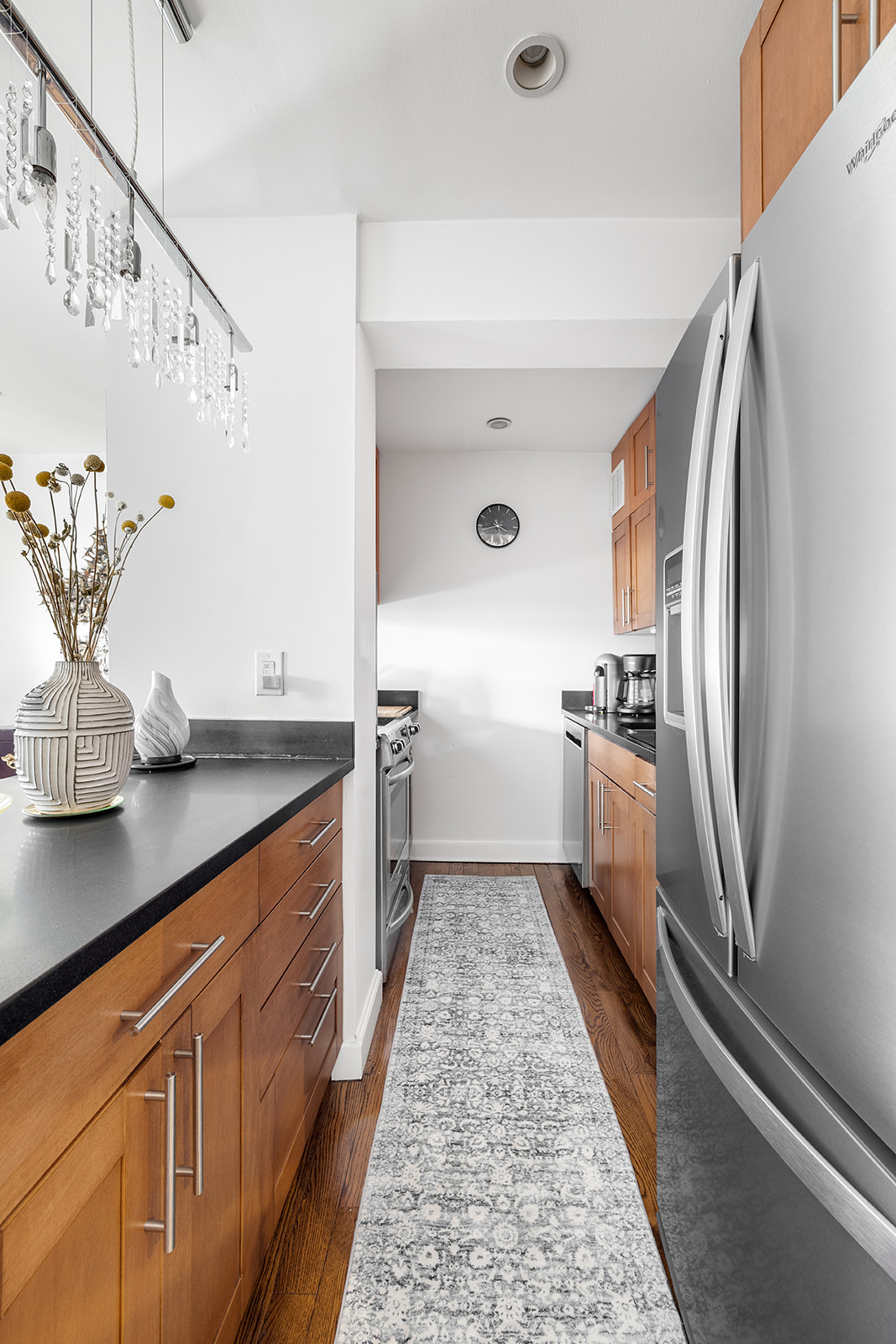376 West Street, Unit 1A Manhattan, NY 10014 - Photo 3 of 11 a kitchen with stainless steel appliances a sink and a refrigerator